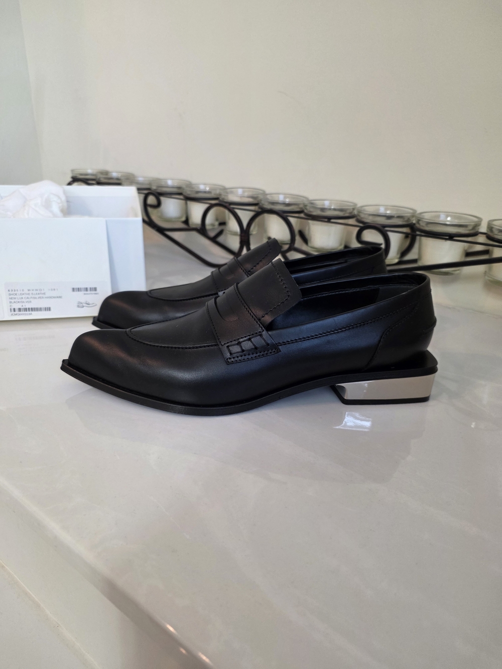 Alexander McQueen Black Leather Women's Loafers with Silver Heel Accent